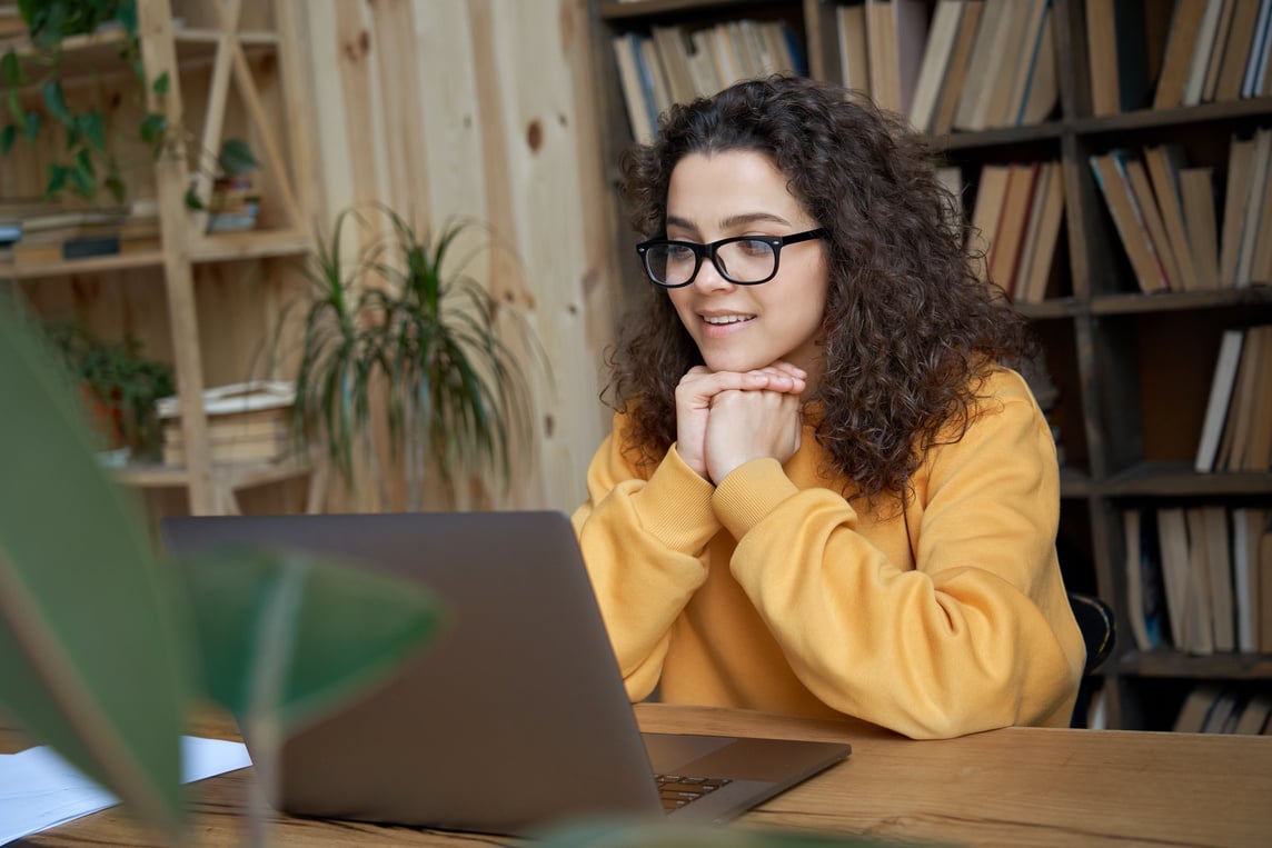 Student Watching Online Education Webinar on Laptop